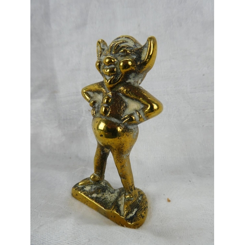 64 - A small brass cherub door knocker and two brass ornaments.