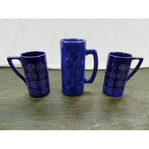 68 - A Portrush Pottery mug and two Portmeirion Pottery mugs.