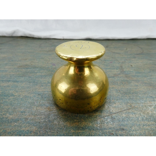 70 - A brass two pound shop weight.