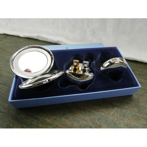 73 - A stunning boxed Newbridge Silverware cosmetic set.