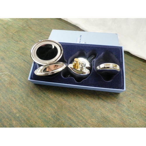 73 - A stunning boxed Newbridge Silverware cosmetic set.