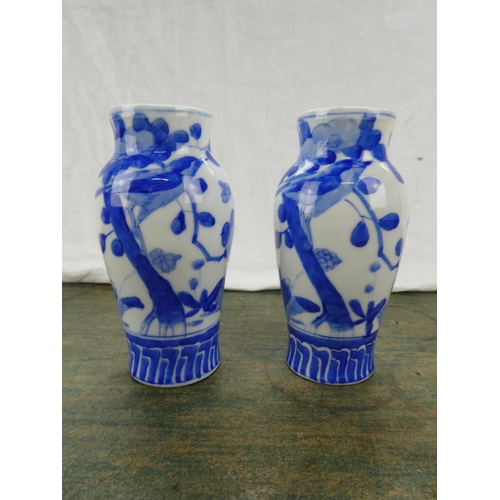 74 - A pair of antique Chinese blue and white patterned vases.