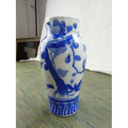 74 - A pair of antique Chinese blue and white patterned vases.