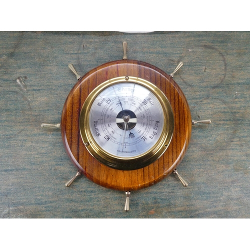 85 - A Weathermaster barometer mounted on a ship style wheel.