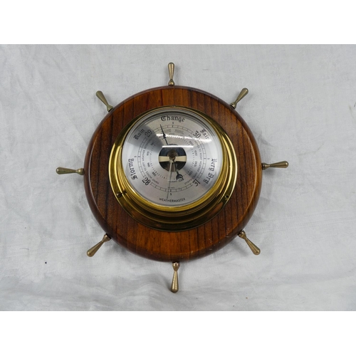 85 - A Weathermaster barometer mounted on a ship style wheel.