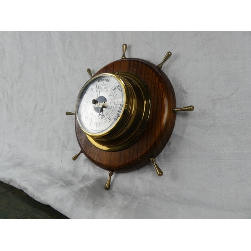 85 - A Weathermaster barometer mounted on a ship style wheel.