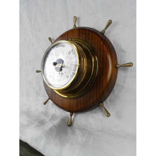 85 - A Weathermaster barometer mounted on a ship style wheel.