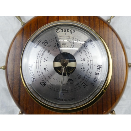 85 - A Weathermaster barometer mounted on a ship style wheel.