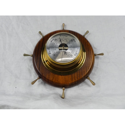 85 - A Weathermaster barometer mounted on a ship style wheel.