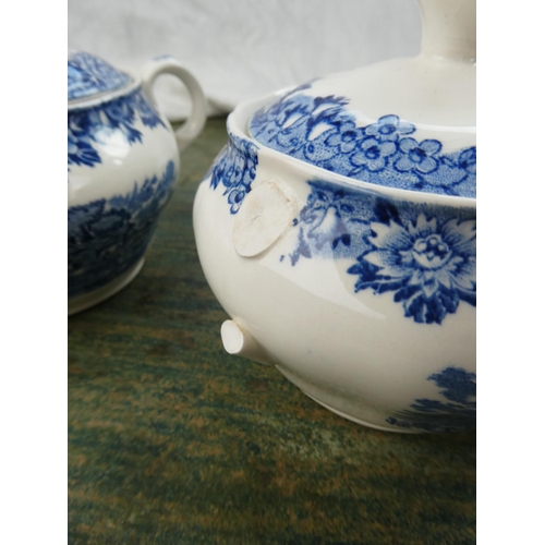 88 - A collection of blue and white ware to include a Crown Devon milk jug in the shape of a cow, a Spode... 