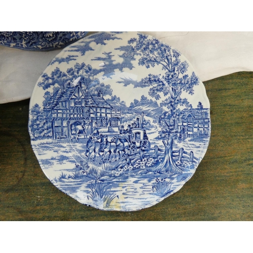 88 - A collection of blue and white ware to include a Crown Devon milk jug in the shape of a cow, a Spode... 