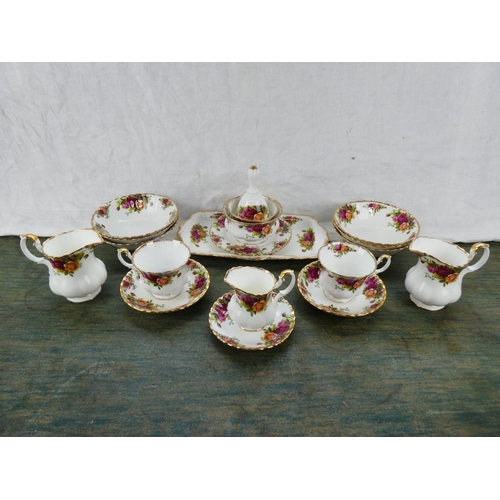 89 - A collection of Royal Albert Old Country Rose to include a sandwich plate, milk jug and sugar bowls,... 