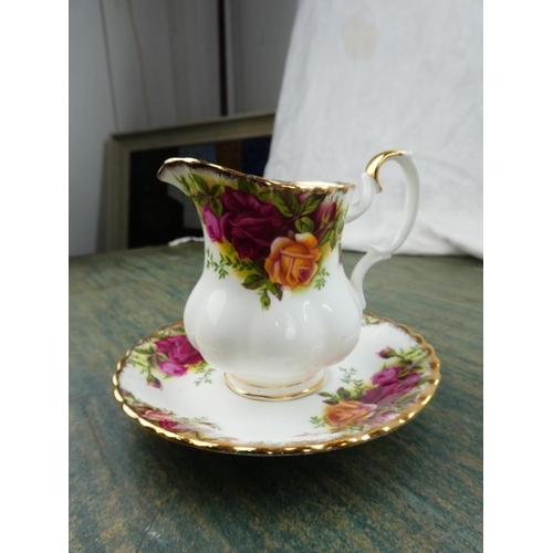 89 - A collection of Royal Albert Old Country Rose to include a sandwich plate, milk jug and sugar bowls,... 