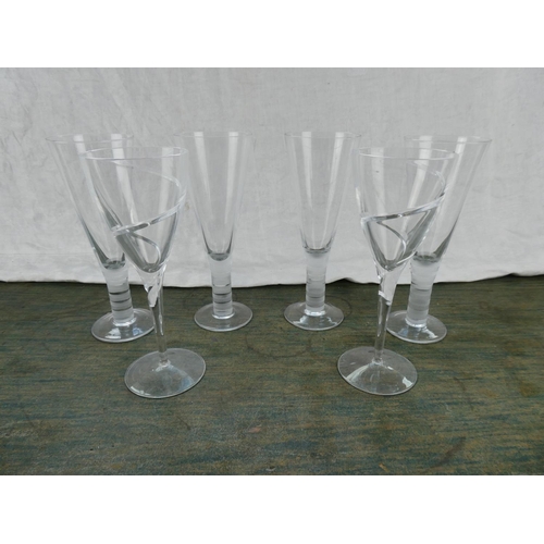 91 - A stunning set of etched stem wine glasses and another.