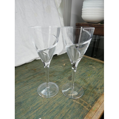 91 - A stunning set of etched stem wine glasses and another.