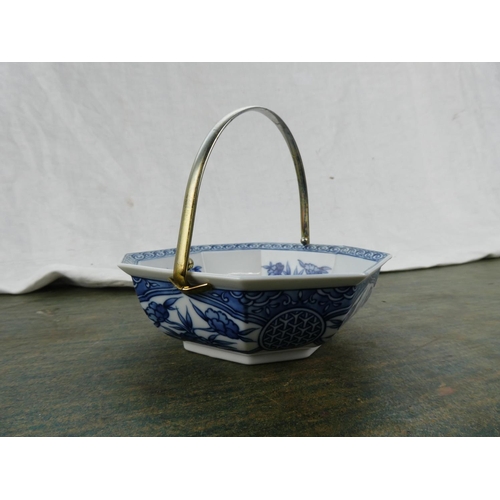 93 - A Chinese/ Oriental dish with a silver plated handle.