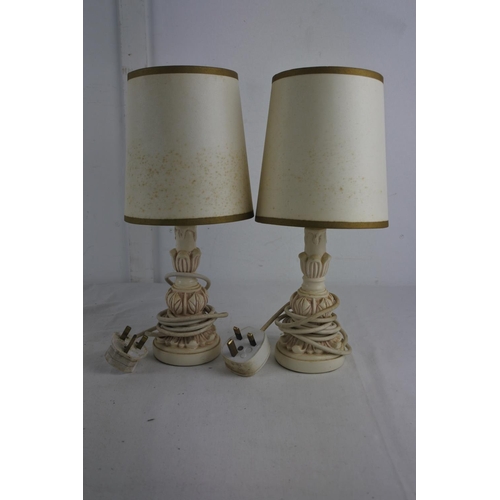 242 - A pair of bedside table lamps and shades.