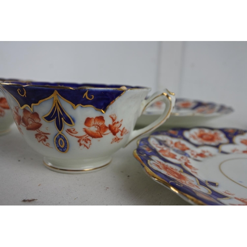 256 - Two Wellington China cups, saucers and plate.