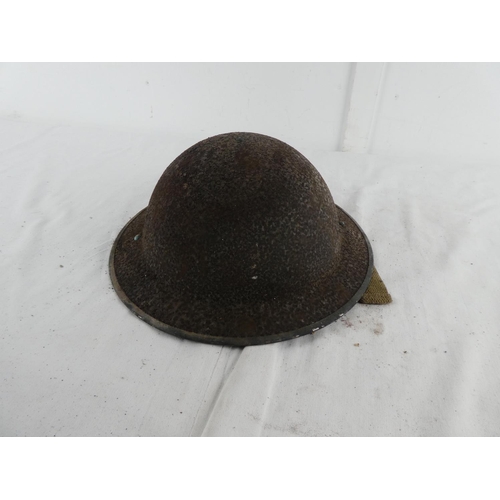 296 - A British WW2 era steel brodie helmet.