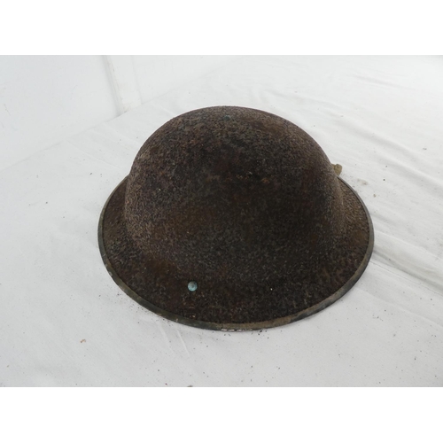 296 - A British WW2 era steel brodie helmet.