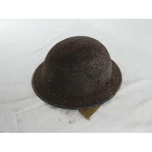 296 - A British WW2 era steel brodie helmet.