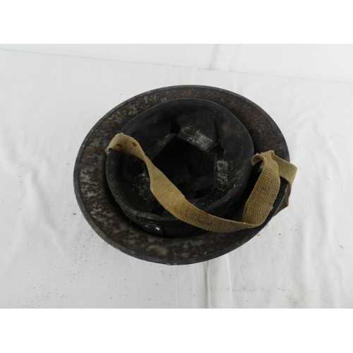 296 - A British WW2 era steel brodie helmet.