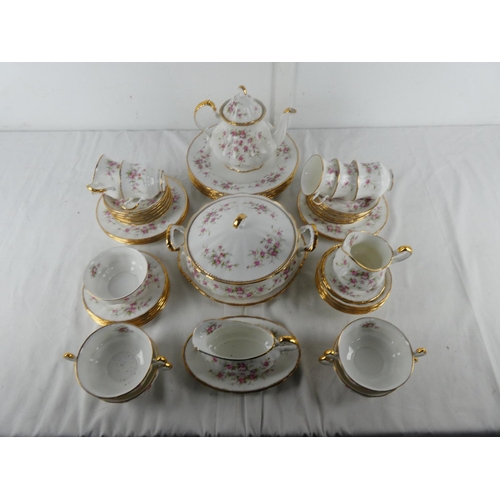 301 - A large lot of Paragon 'Victoriana Rose' table ware to include teapot, milk jug and sugar bowl, dinn... 