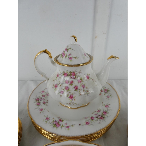 301 - A large lot of Paragon 'Victoriana Rose' table ware to include teapot, milk jug and sugar bowl, dinn... 