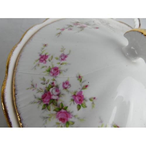 301 - A large lot of Paragon 'Victoriana Rose' table ware to include teapot, milk jug and sugar bowl, dinn... 