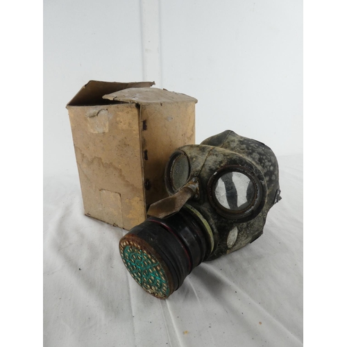 302 - A boxed vintage gas mask.