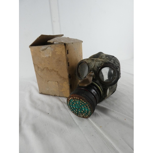 302 - A boxed vintage gas mask.