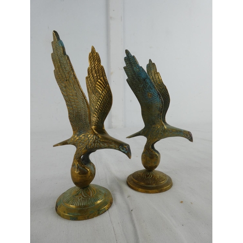 282 - A pair of brass eagles.