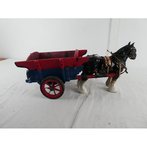 292 - A ceramic Clydesdale horse and cart.