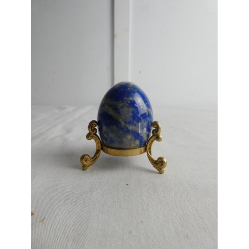 265 - A marble egg on stand.