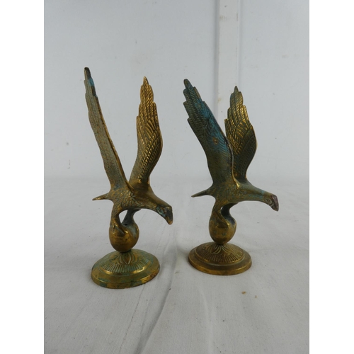 282 - A pair of brass eagles.