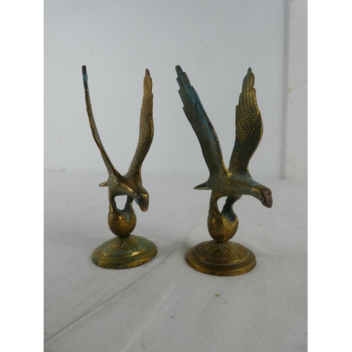 282 - A pair of brass eagles.