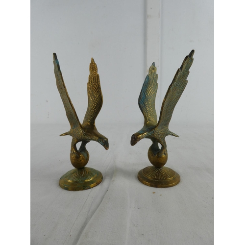 282 - A pair of brass eagles.