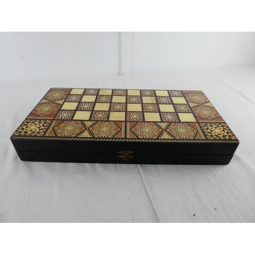 286 - A cased chess set (a/f).