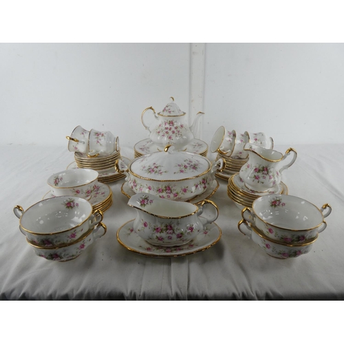 301 - A large lot of Paragon 'Victoriana Rose' table ware to include teapot, milk jug and sugar bowl, dinn... 