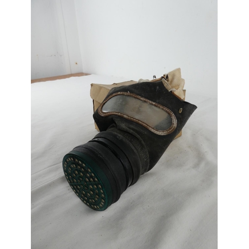 306 - A boxed vintage gas mask.