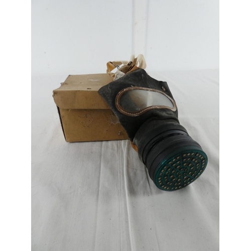 306 - A boxed vintage gas mask.