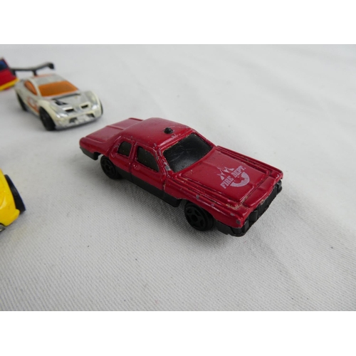 308 - A collection of vintage toy cars.