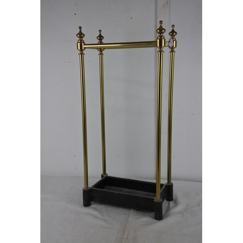 167 - A cast iron tray and brass laquared stick/umberlla stand.