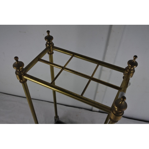 167 - A cast iron tray and brass laquared stick/umberlla stand.