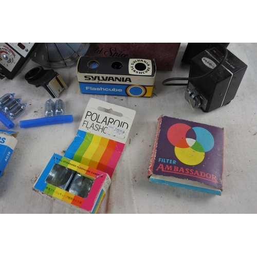 4 - A box of assorted vintage camera film, a boxed Hanimex Dual Bouncemaster II BC Flashgun and more.