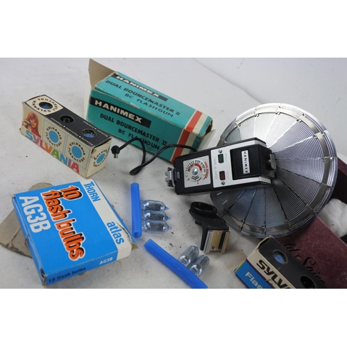 4 - A box of assorted vintage camera film, a boxed Hanimex Dual Bouncemaster II BC Flashgun and more.