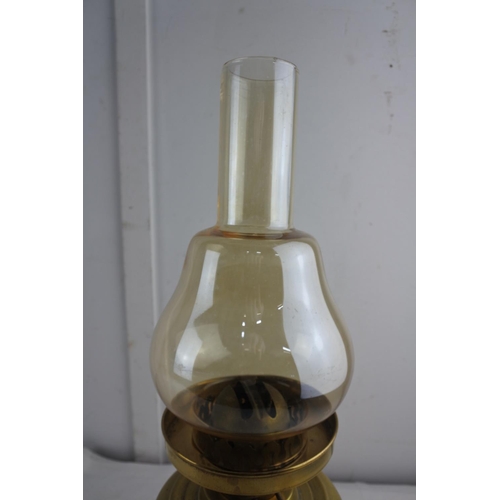 65 - A brass based oil lamp and shade.