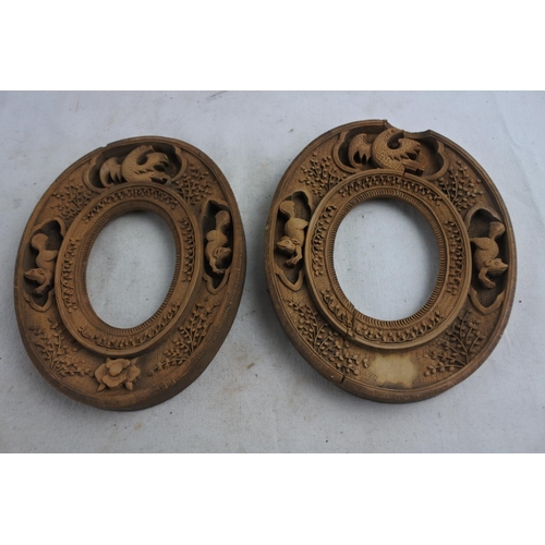 71 - A pair of highly carved picture frames.