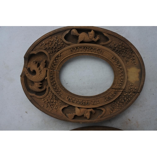 71 - A pair of highly carved picture frames.