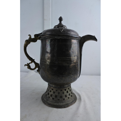 72 - An unusual large antique metal teapot with brass handle.